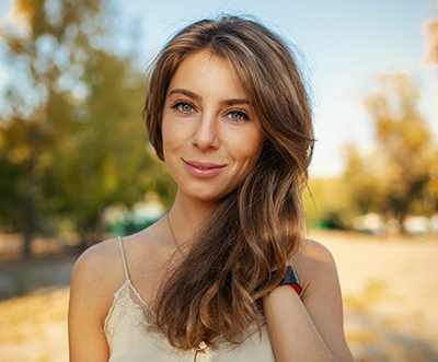 beautiful girl on a background of autumn landscape