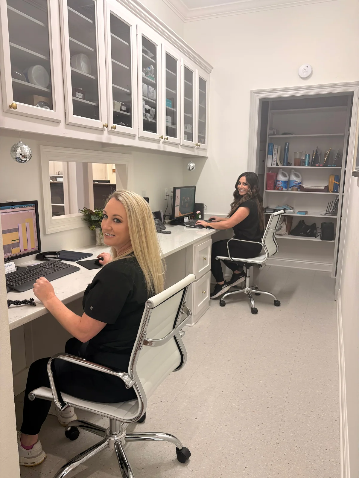 front desk assistants working at computer