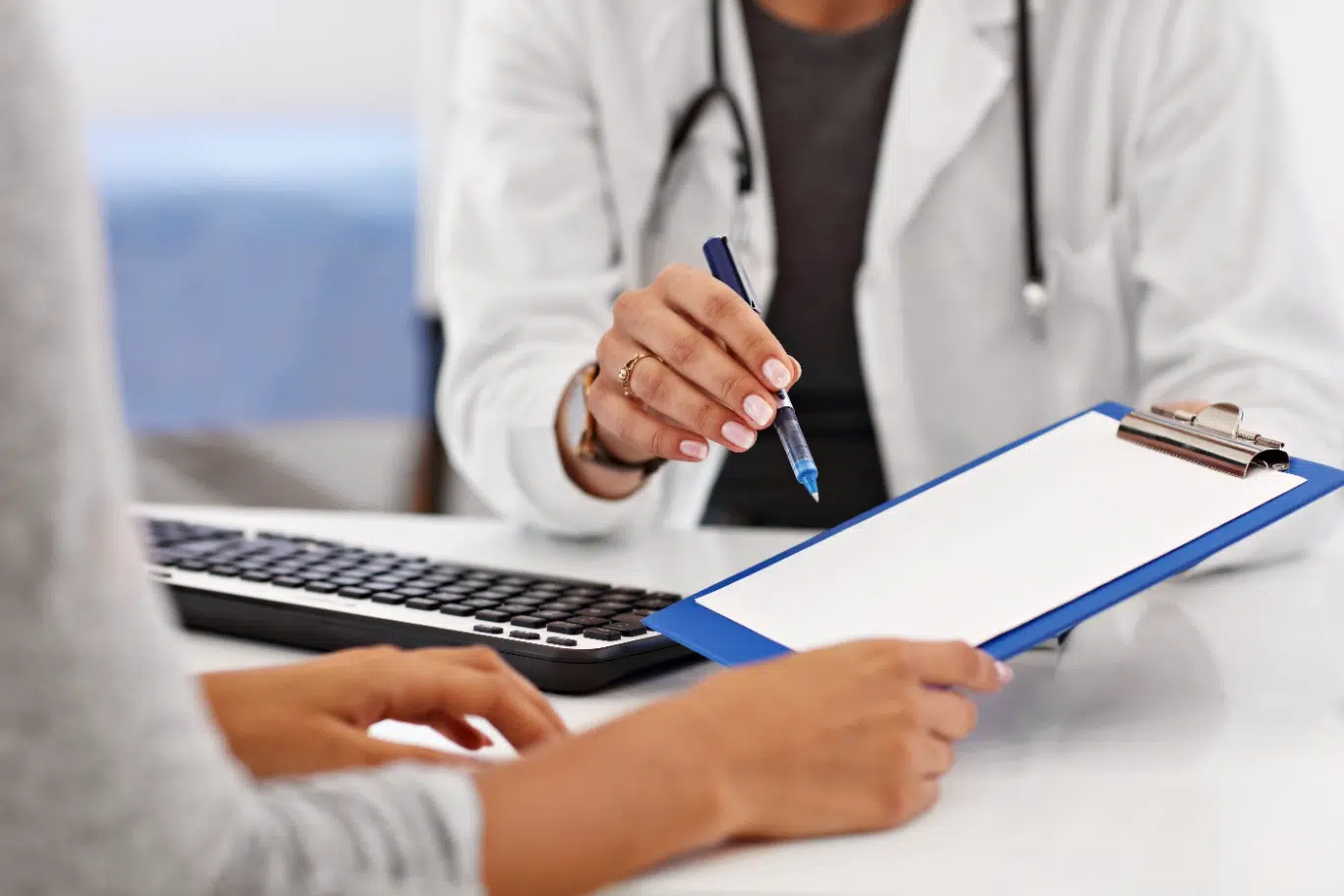 adult woman having a visit at female doctors office doctor and consultation with patient for medication